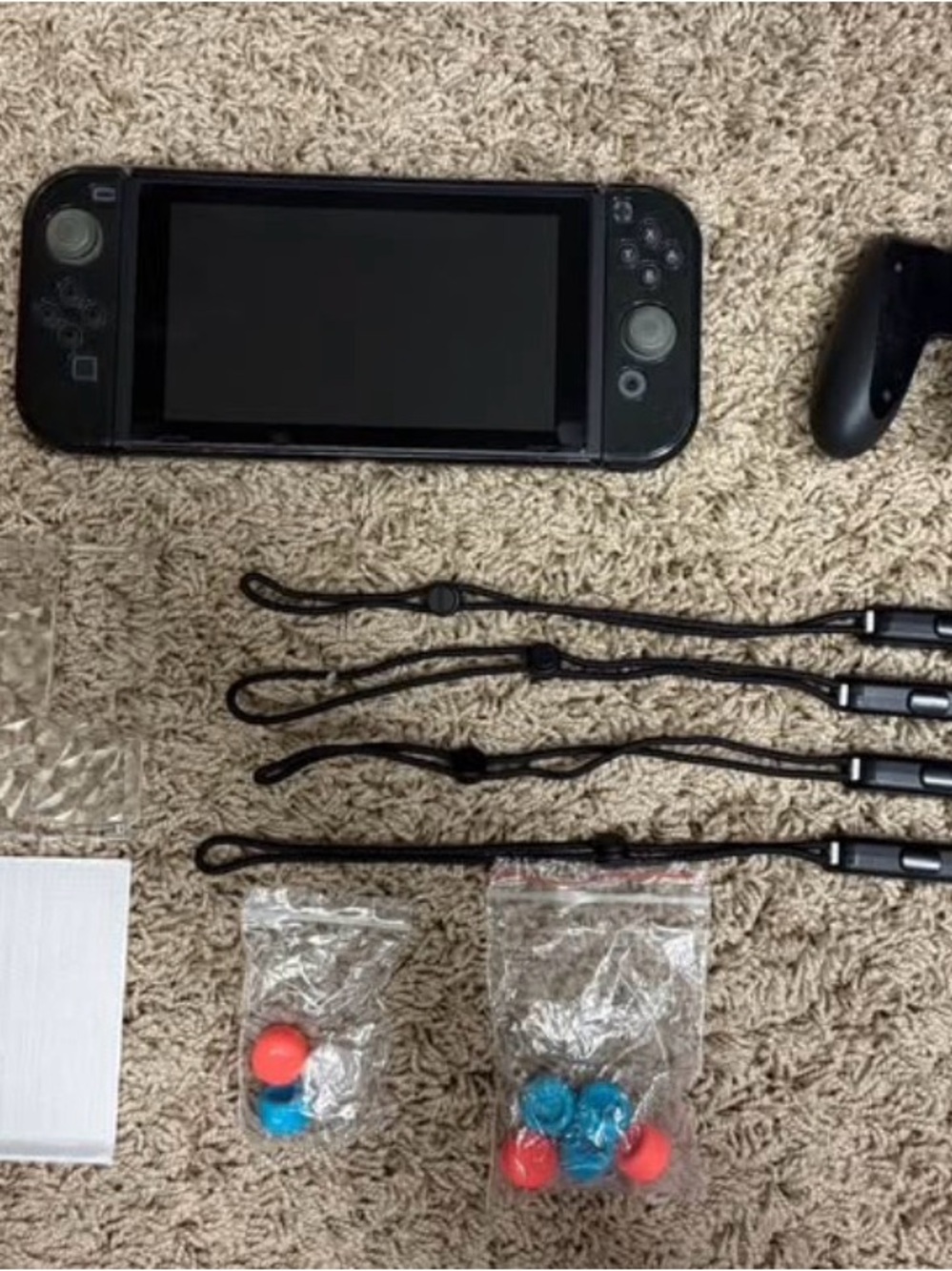 Nintendo Switch + 265GB MicroSDXC Card + Extra Joy-Cons + Cases